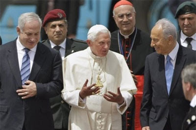 Pope Benedict XVI, center, walks with Israeli president Shimon Peres, right, and Prime Minister Benjamin Netanyahu, left, during an official departure ceremony at Ben Gurion airport near Tel Aviv, Israel, Friday, May 15, 2009. Source: Associated Press