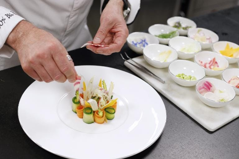 Italian chef Paolo Sari cooking in