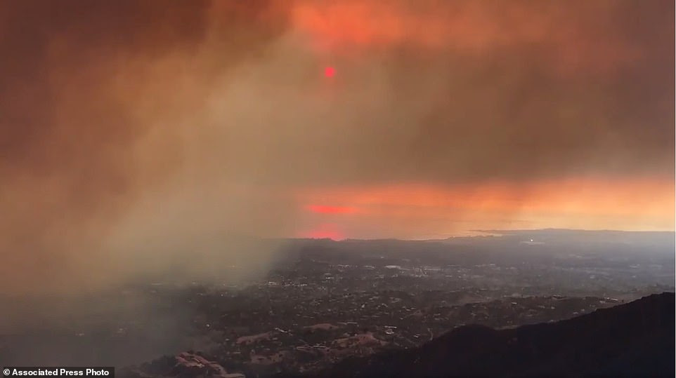 Smoke from a wildfire drifts towards Santa Barbara Airport in the distance in Santa Barbara
