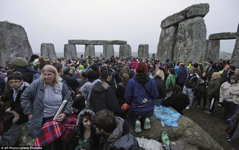 No damp squib: Thousands of people marked the summer solstice at Stonehenge despite the celebration being one of the wettest in years