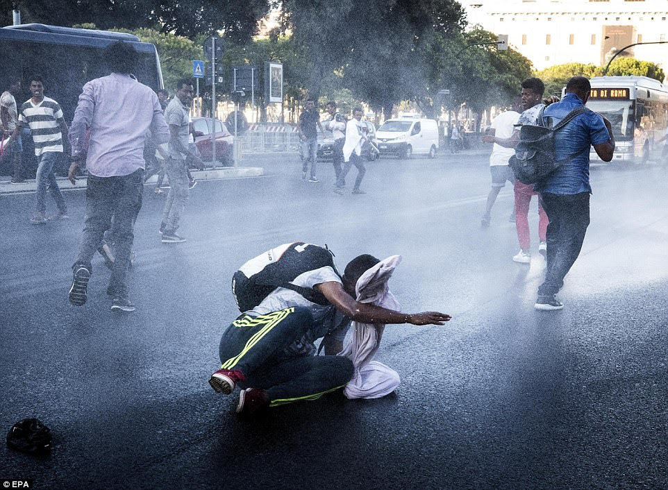 Two people were detained following today's clashes in which migrants were knocked to the ground by police water cannons
