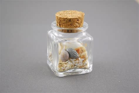 Mini Glass Bottle Square with Cork 1.4oz (Pack of 24) Mini Glass Bottle Square with Cork 1.4oz (Pack of 24)
