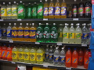 Soft drinks on shelves in a Woolworths superma...