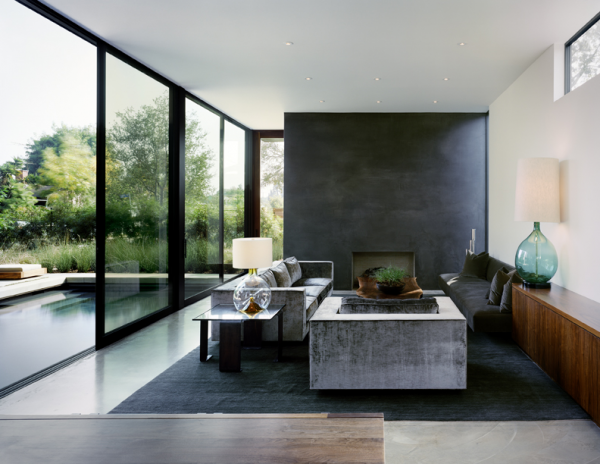 The use of concrete and wood turn this modern living room into a testament to mid-century design.