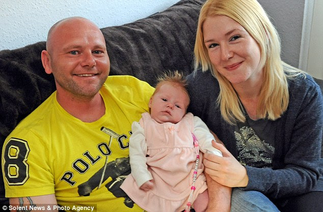 Happy family: Cain Fleet and Natasha Hall with baby Sophie who is flourishing at four weeks old