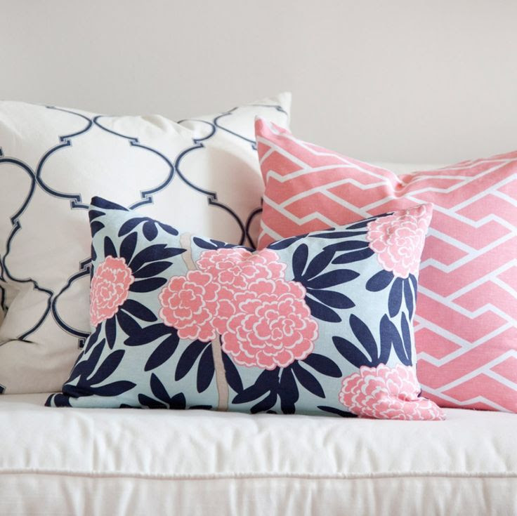 Summer Trends 2013: 60s Prep. Navy and pink preppy pillows in mixed patterns. The secret to mixing is to choose a color scheme, then a variety of prints: one large scale (the quatrefoil), a geometric (the pink bamboo), and a floral (notice the floral is not too dense of a pattern nor is it too loose with lots of negative space). Its all about finding balance and proportion.