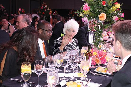 Mayor Byron Brown sits with his wife, and Patricia Cohen.