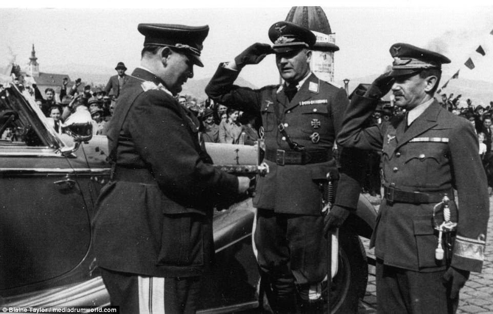 On 25 March 1938, Goering officially received the handover of the former Austrian Air Force to Germany by its commander under both countries, Gen. Alexander Löhr, saluting hand to cap at far right. Note the hastily mounted German Air Force wings on his cap! The man saluting at center is an unidentified German Air Force officer. Gen. Löhr went on to hold important Air Force commands during the Second World War under his new chief, Goering.