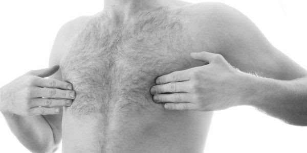 Young man covering nipples
