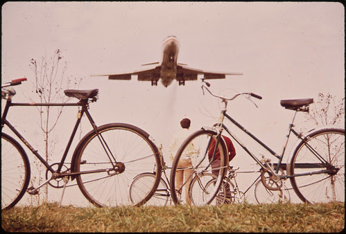 Jet Roars over Bicycle Path near Washington's Nation Airport. Noise-Decibel Level from Aircraft at This Altitude Can Cause Permanent Ear Damage. 11/1972
