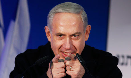 Netanyahu pointing both fingers in front of microphone