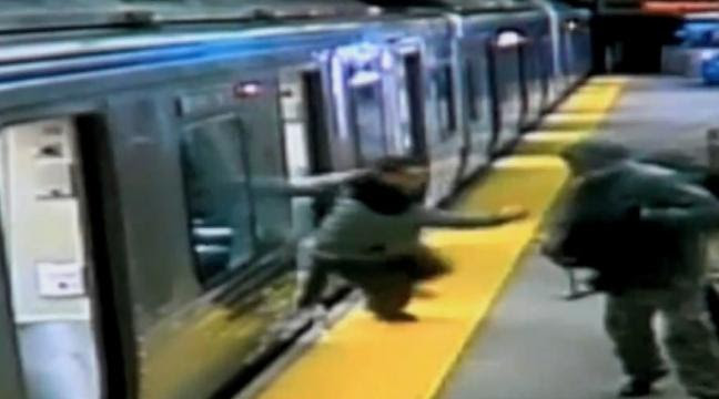Watch shocking CCTV footage of a commuter thrown onto train tracks after being robbed and shot with a stun gun