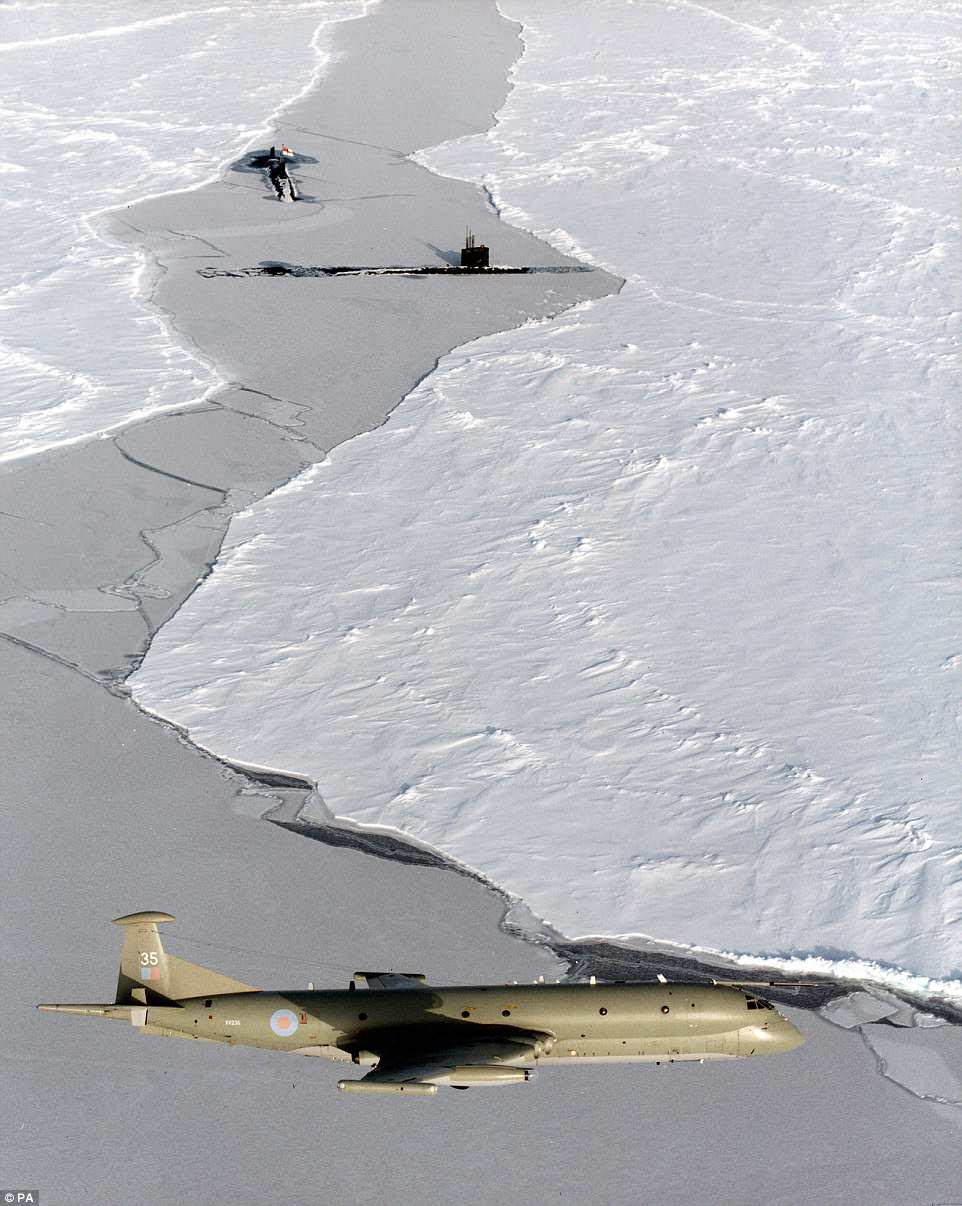 AF Nimrod MR2 on patrol in the skies over the North Pole, with two RN submarines breaking through the ice below