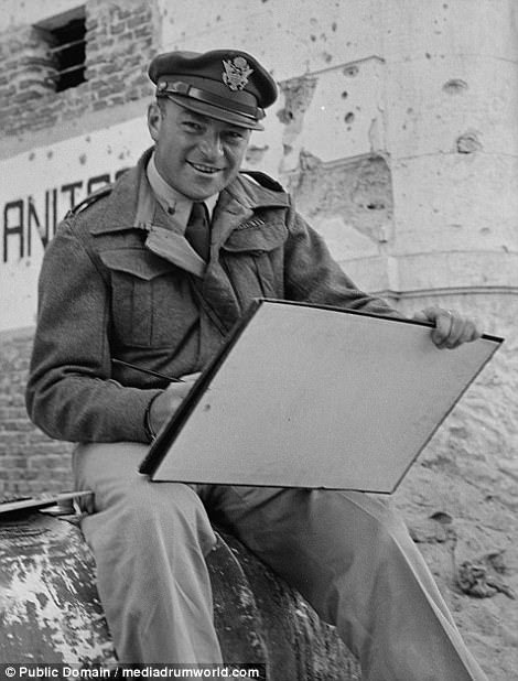 A smiling Lieutenant William Marx of New York City, who was attached to the public relations office of the US Army 9th Air Force, enjoying a spot of painting in the streets of Tobruk