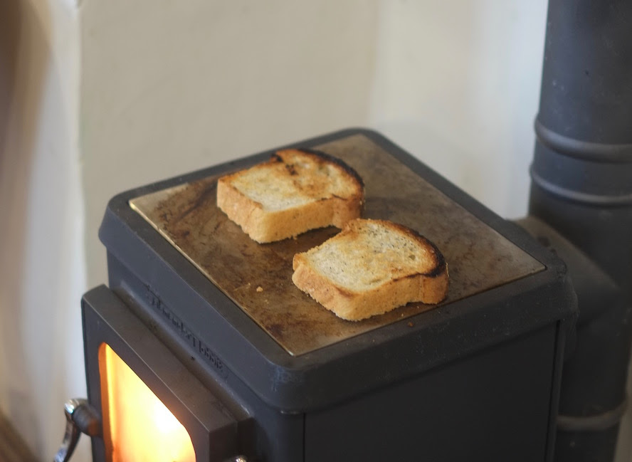 Making toast using your tiny woodstove