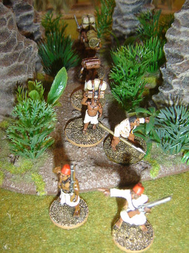 Porters move through jungle
