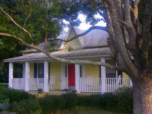 Yellow House Blue Shutters Modern World Furnishing Designer