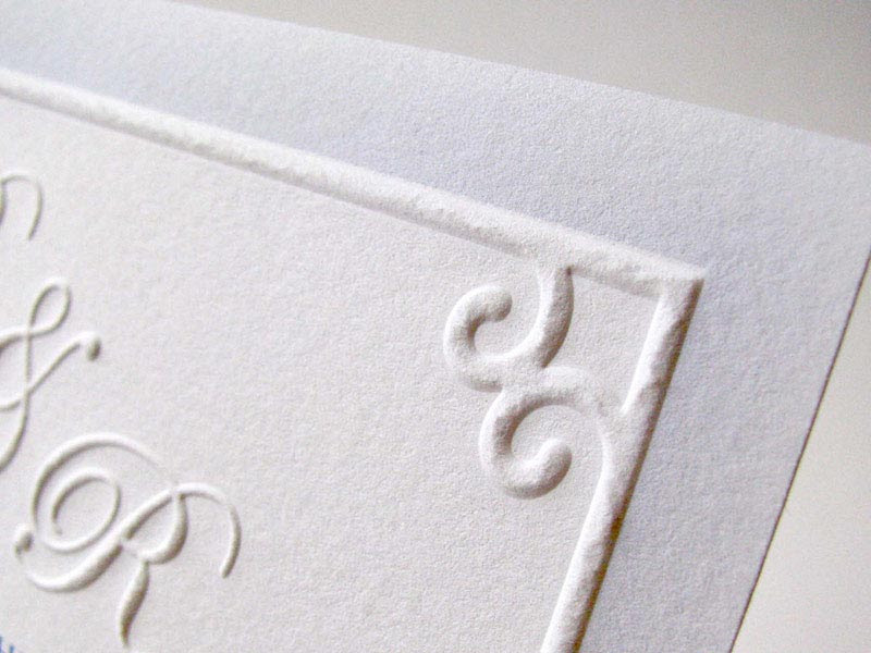 Embossed border monogram wedding invitation
