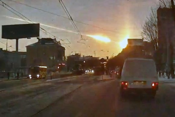 A meteorite flashes across the sky over Chelyabinsk, Russia, taken from a dashboard camera.