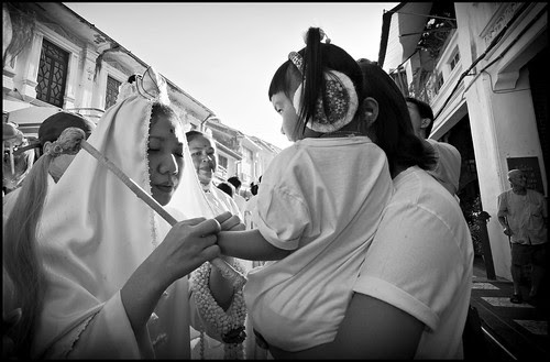 Ma Song blessing a child