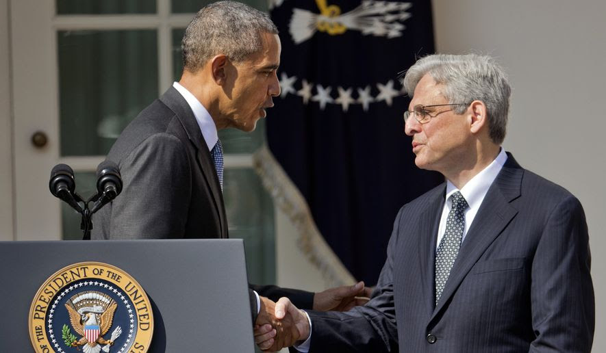 Federal appeals court judge Merrick Garland shakes hands with President Obama as he is introduced as Obama's nominee for the Supreme Court on Wednesday in the Rose Garden of the White House. (Associated Press)