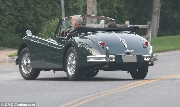 Father and son weer spotted taking a spin around Brentwood in California on Tuesday 