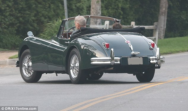Father and son weer spotted taking a spin around Brentwood in California on Tuesday