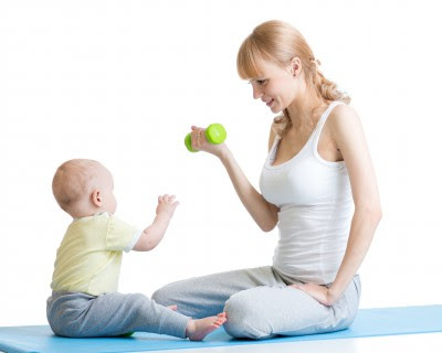 Mother and little kid spending time in gymnastics isolated