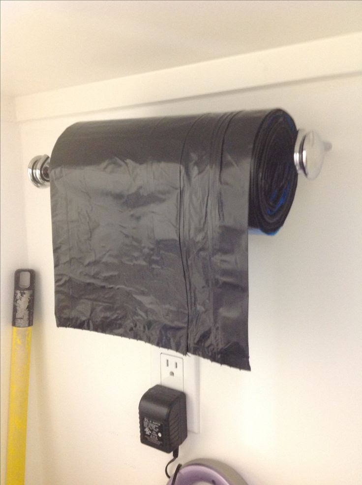 Paper towel holder for garbage bags