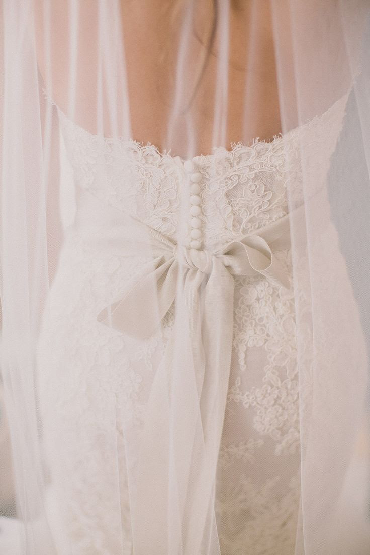 Sweet bow + lace dress | Photography: Dave Richards Photography - dave-richards.com Read More: http://www.stylemepretty.com/little-black-book-blog/2014/05/15/elegant-la-venta-inn-wedding/