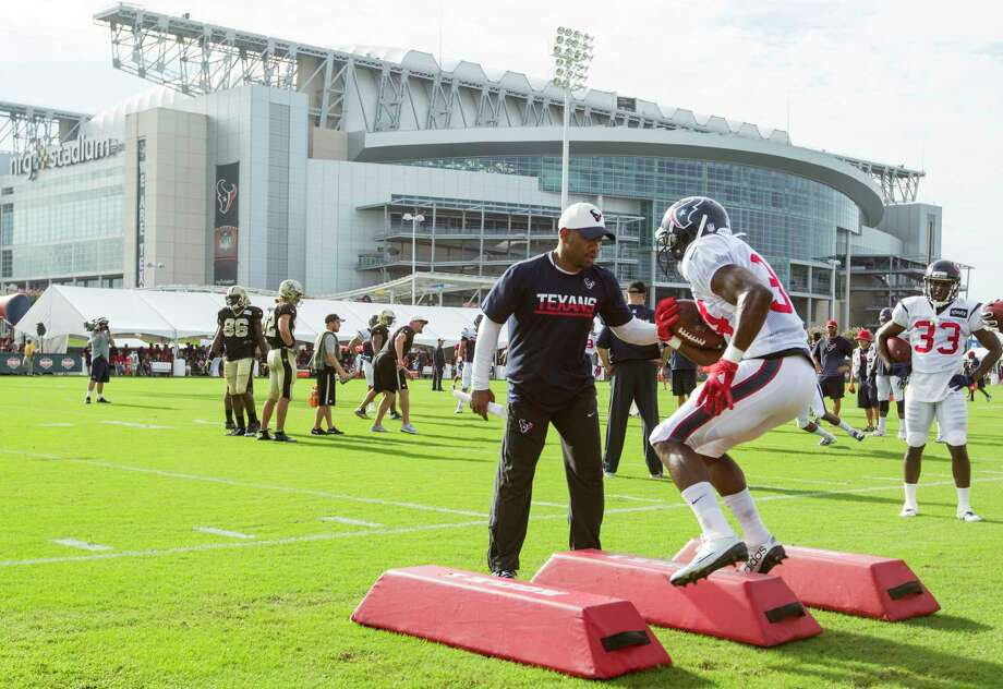 The Texans have prepared for the season at the Houston Methodist Training Center since football returned to the Bayou City in 2002. Despite the steamy temperatures, Bob McNair thought a local presence was vital for a fledgling brand. Above, Charles London runs drills with Tyler Ervin last year. Photo: Brett Coomer, Staff / © 2016 Houston Chronicle