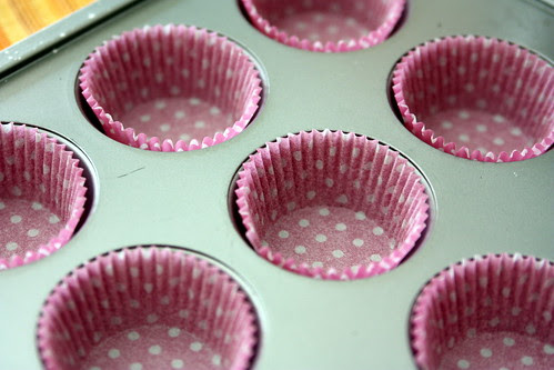 Cups getting ready to be filled with sweet cupcaky batter