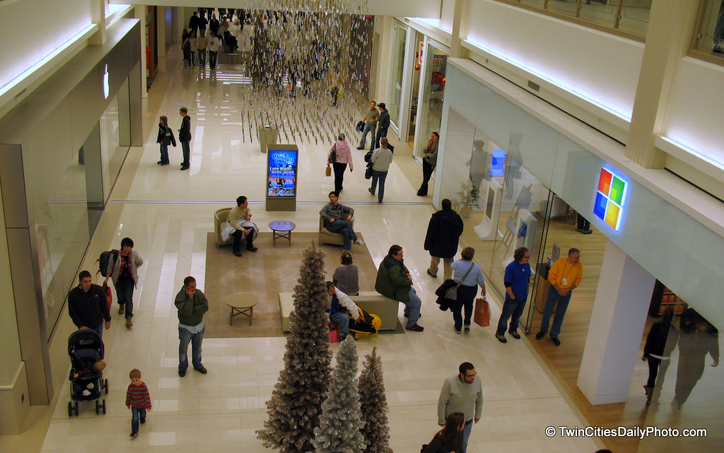 If you look closely at this photo, on the left side of the hallway, above the store entrance is the Apple logo. The logo above the store on the right side of the hallway belongs to Microsoft.