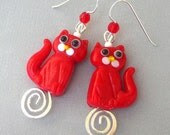 Red cat earrings, lampwork glass on silver swirls - Mindielee Red cat earrings, lampwork glass on silver swirls - Mindielee