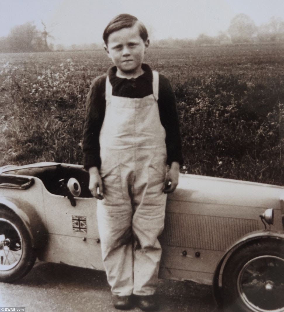 Boy racer: Michael Banfield, aged 5, with his first car although he did not buy his first classic until 1959, many years later