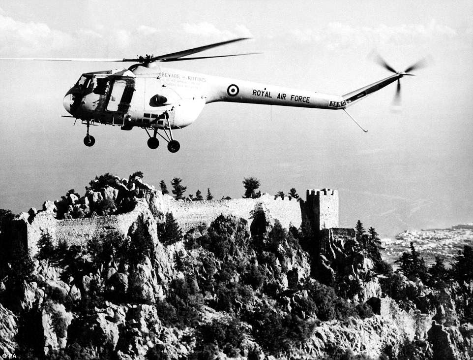 A Sycamore helicopter of 103 Squadron based at Nicosia, Cyprus, flying over St Hilarian Castle near Kyrenia on the north of the island in July 1961