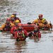 Emergency workers waded through a flooded street in York, England, on Monday. Prime Minister David Cameron defended the government’s record on flood defenses during a visit there, saying that it had committed to spend 2.3 billion pounds.
