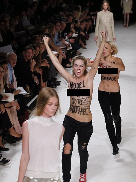 Topless Femen protestor stages mock suicide at Notre Dame 