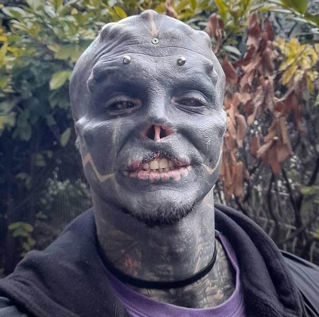 Completely tattooed man who wants to become a 'black alien' has had his