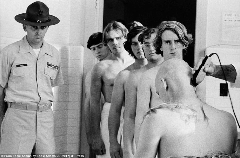 Marine Corps troops wait in line to have their head shaved in 1970. Adams considered himself a patriot and a Marine