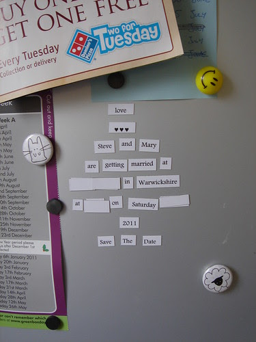 Save the Date magnets in place on our fridge