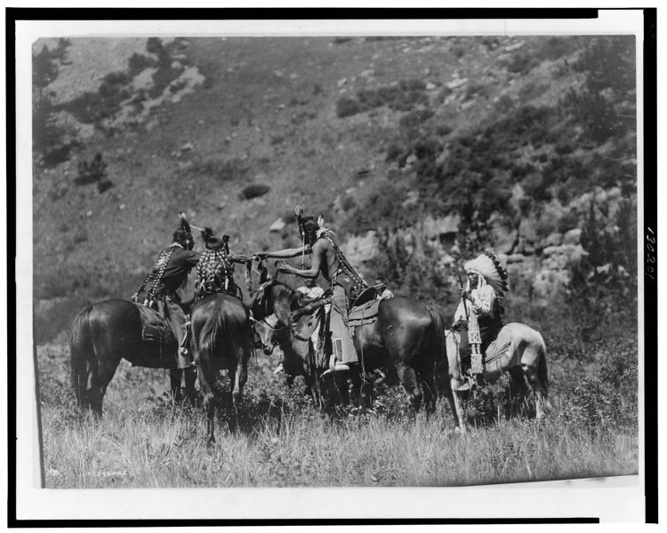 Description of  Title: A swap.  <br />Date Created/Published: c1905.  <br />Summary: Crow men on horseback apparently involved in an exchange.  <br />Photograph by Edward S. Curtis, Curtis (Edward S.) Collection, Library of Congress Prints and Photographs Division Washington, D.C.