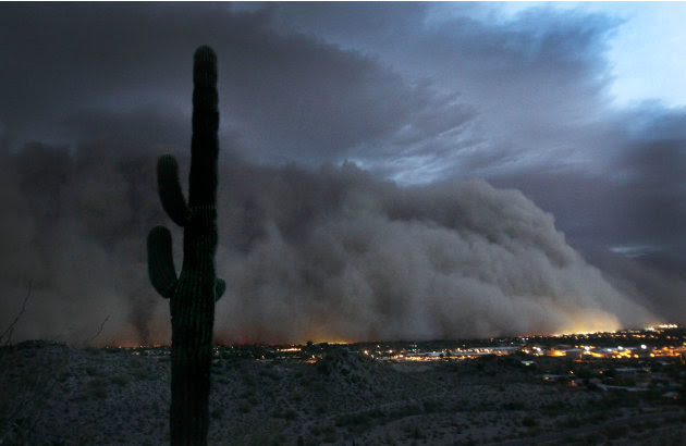 A giant dust storm covers Phoenix, Tuesday, July 5, 2011. (AP Photo/The Arizona Republic, Rob Schumacher)