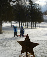 Kids tobogganing on Christmas Eve