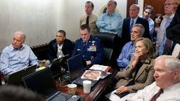 President Barack Obama and Vice President Joe Biden, along with members of the national security team, receive an update on the mission against Osama bin Laden in the Situation Room of the White House, May 1, 2011. Please note: a classified document seen in this photograph has been obscured.