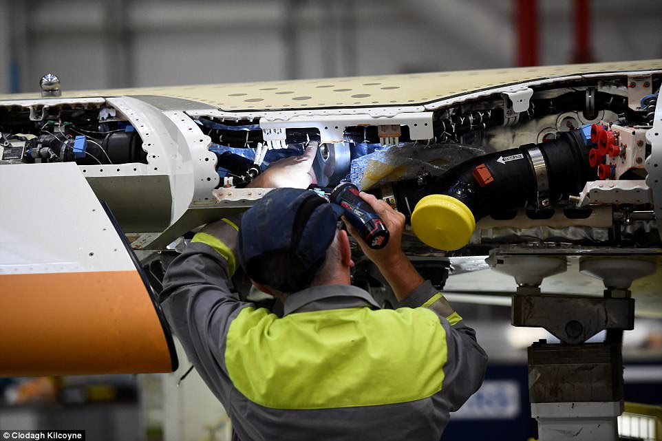 A Bombardier employee was seen working on a C-Series and Theresa May has said she is concerned the trade dispute will kill off the programme