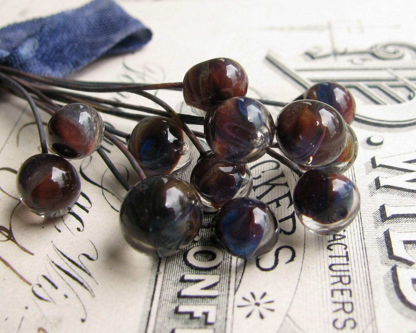 Handmade glass headpins "Belladonna" 8mm round, 3" long copper wire, 22 gauge, lampwork, earthy purple, blue swirl (4 head pins) - FallenAngelBrass Handmade glass headpins "Belladonna" 8mm round, 3" long copper wire, 22 gauge, lampwork, earthy purple, blue swirl (4 head pins) - FallenAngelBrass