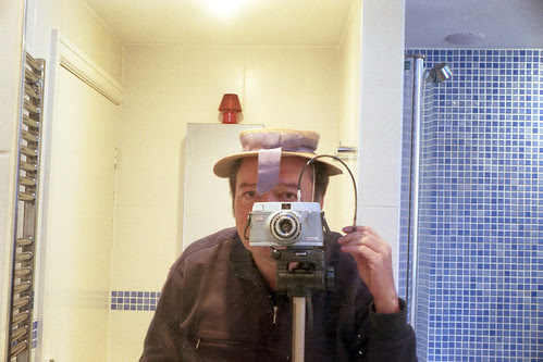 reflected self-portrait with Zeiss Ikonette camera and under-sized boater by pho-Tony
