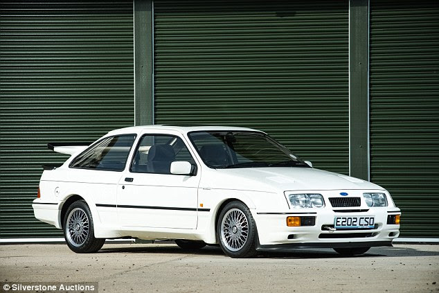 Ford Sierra Cosworths are now selling for six figures - this one pictured achieved more than £100,000 when it went under the hammer last month