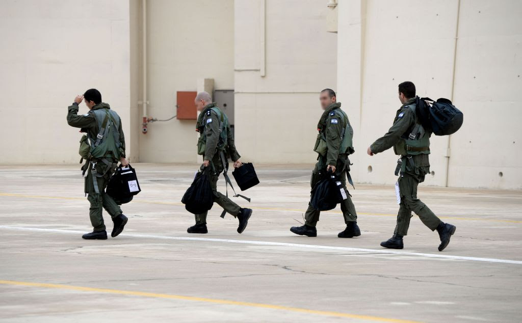 Israeli pilots, whose faces have been blurred for security reasons, walk over to their aircraft during the 'Blue Flag' exercise at Ovda Airfield near Eilat on Oct. 26, 2015. (Israel Air Force) Israeli pilots, whose faces have been blurred for security reasons, walk over to their aircraft during the 'Blue Flag' exercise at Ovda Airfield near Eilat on Oct. 26, 2015. (Israel Air Force)